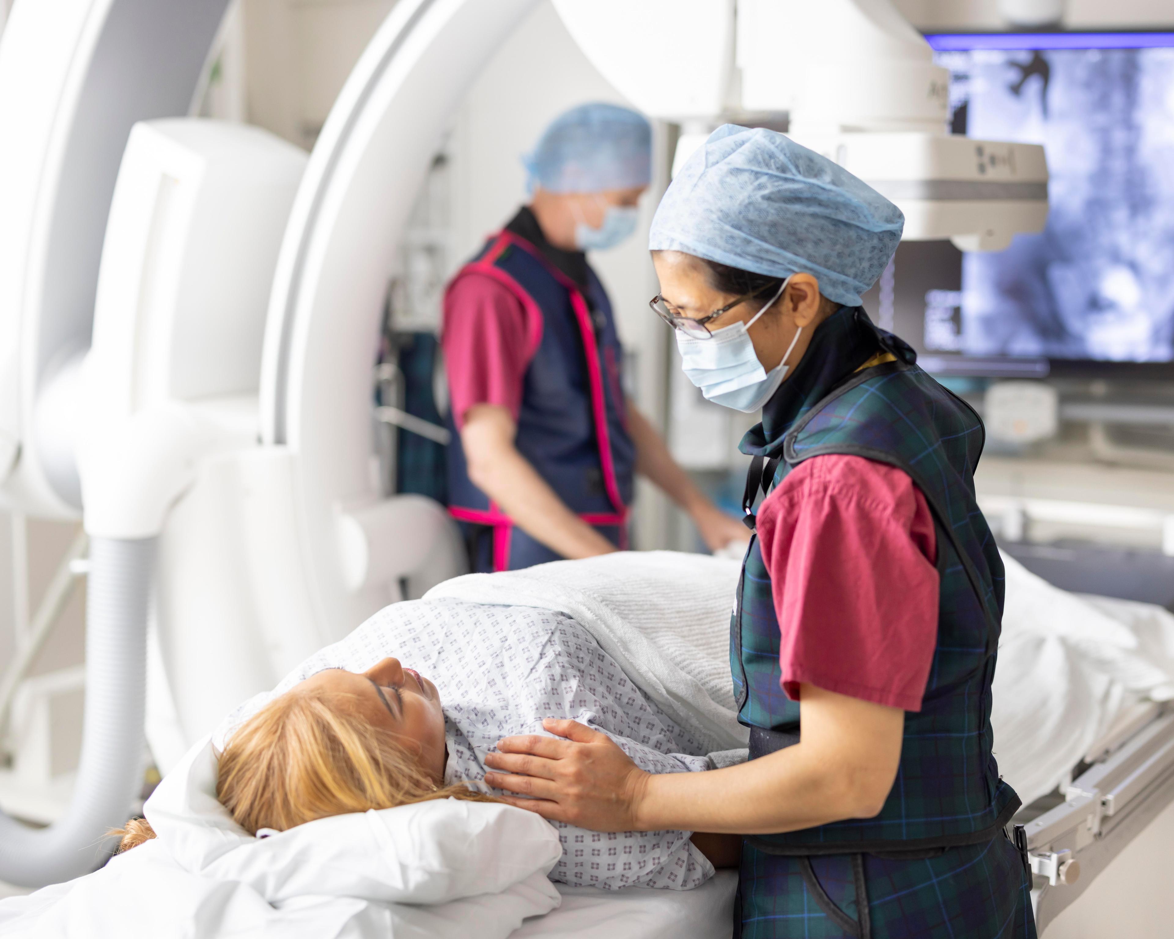 Radiographer talking with patient