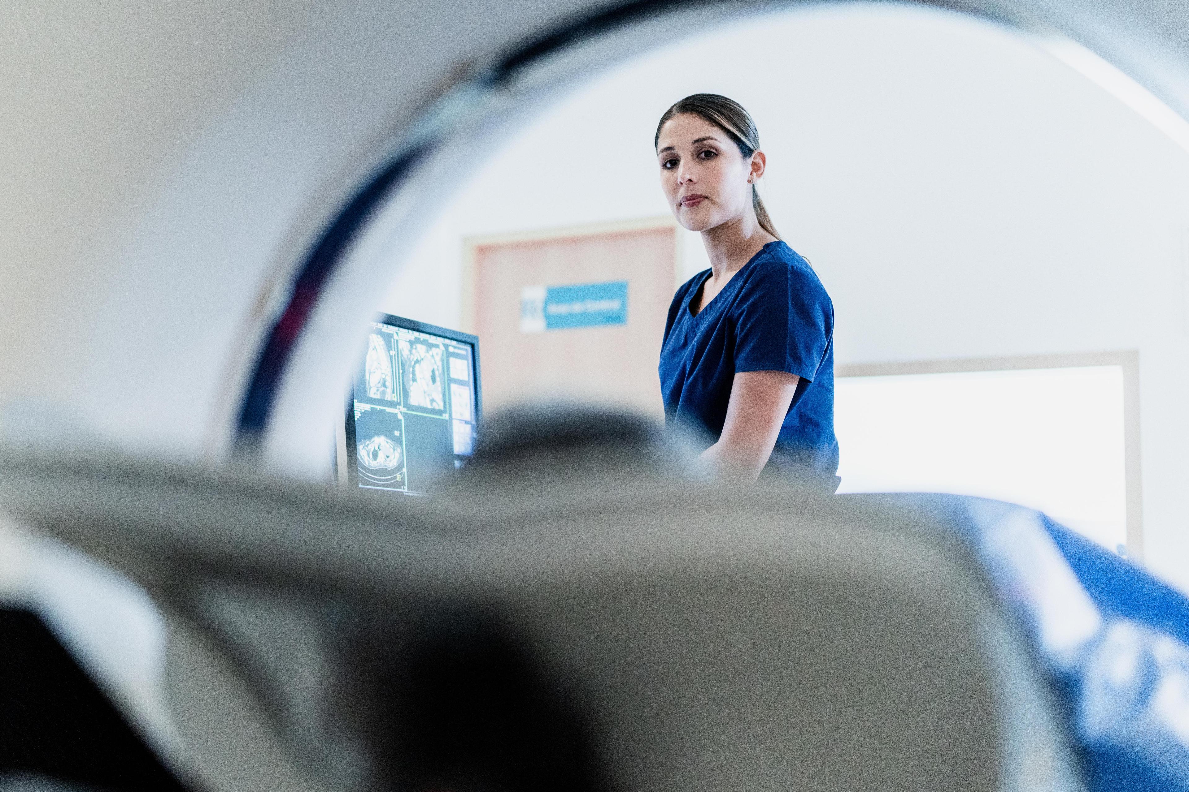 Patient with radiographer CT scan