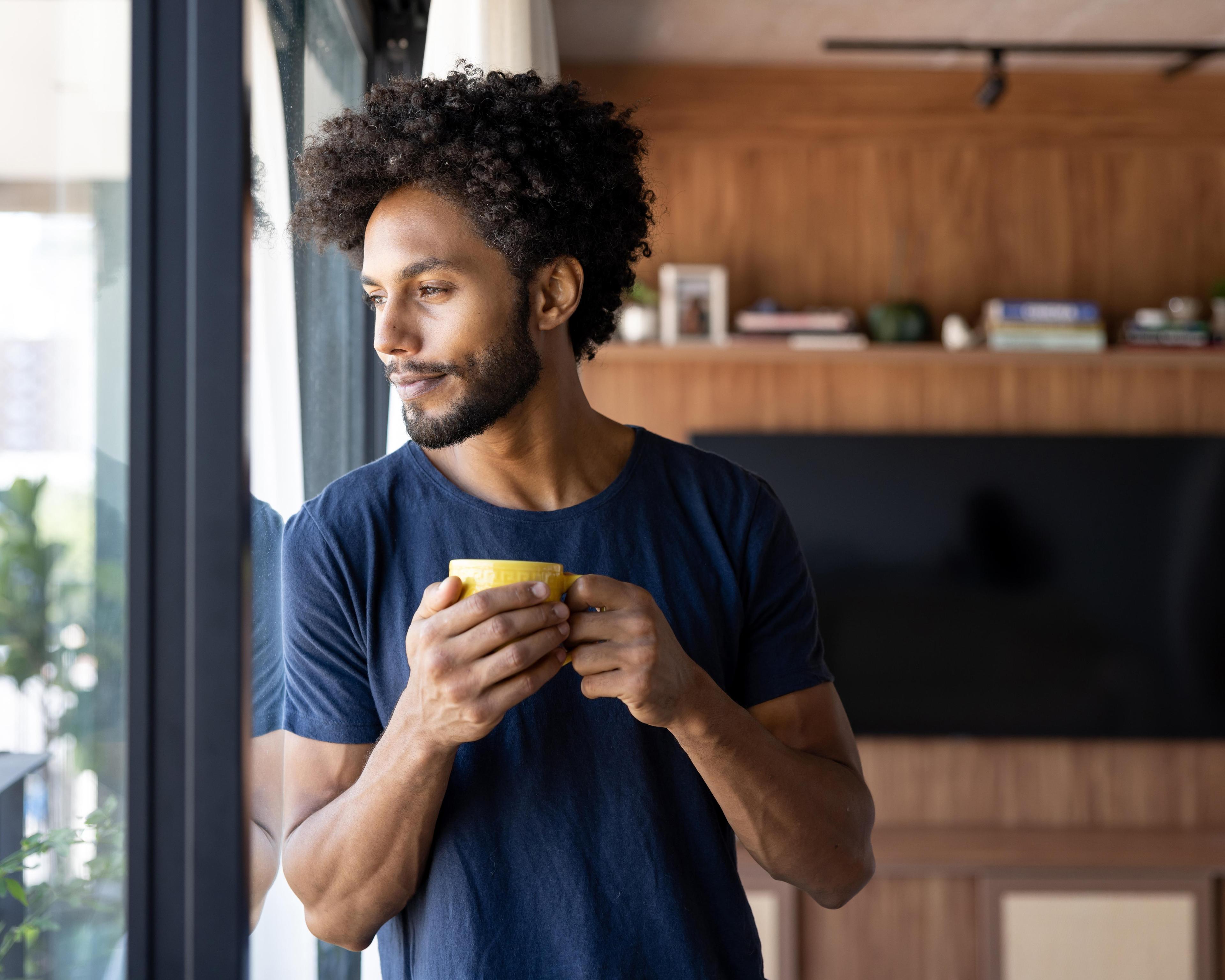 Man drinking a cup of coffee 1475437767.jpg