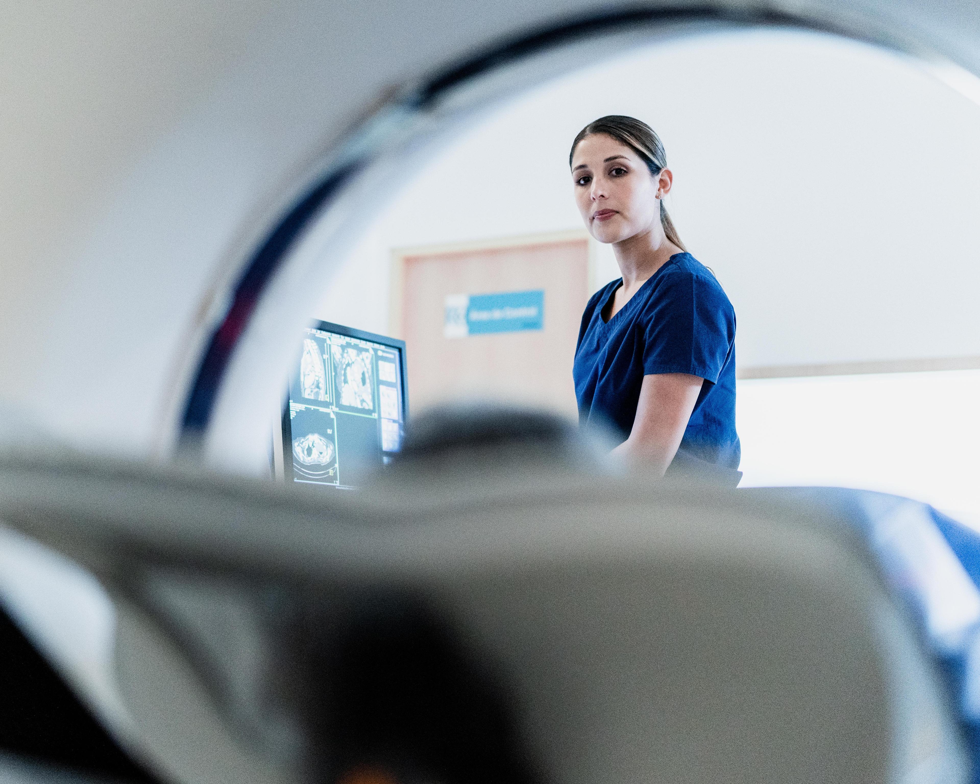 Patient with radiographer CT scan