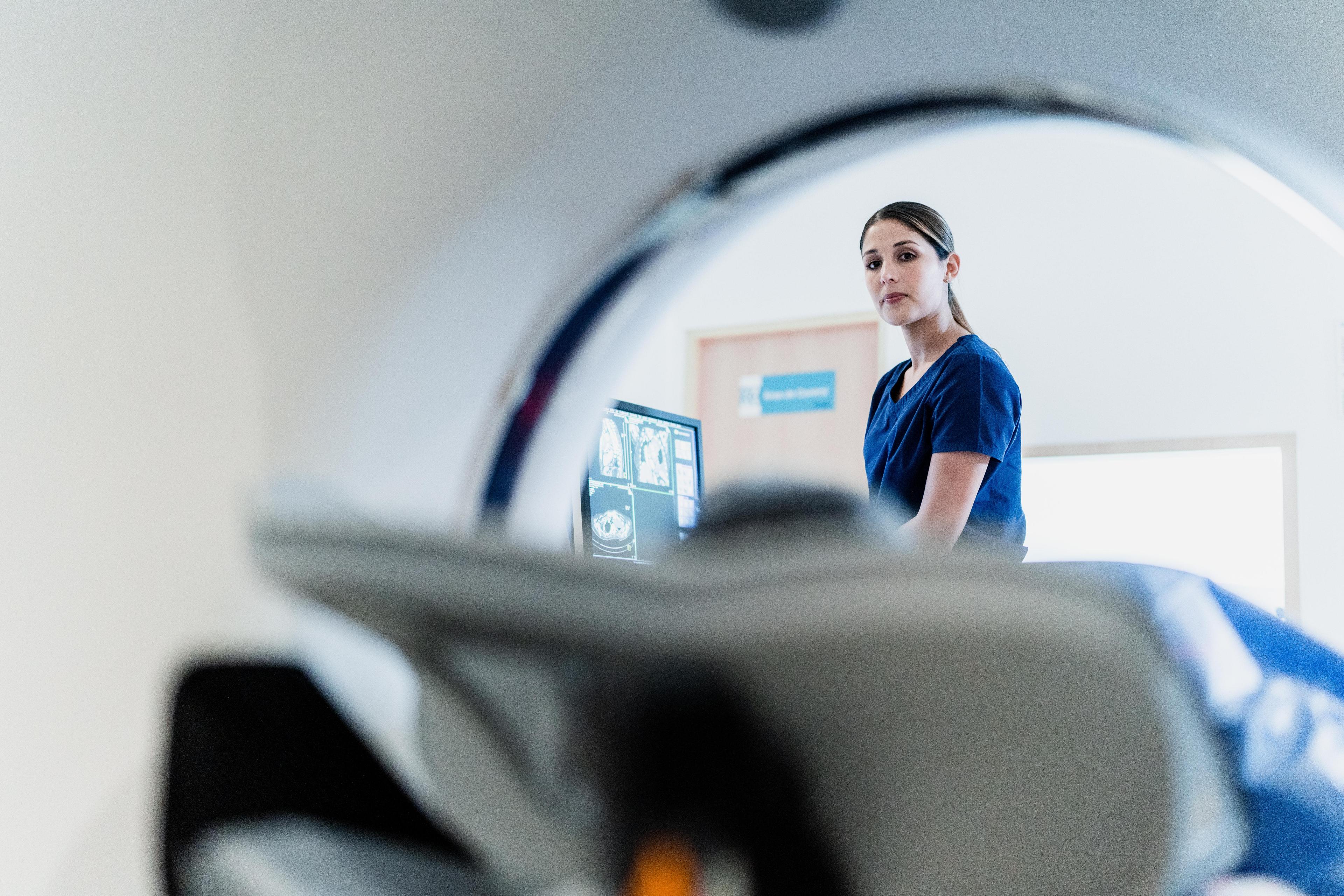 Patient with radiographer CT scan