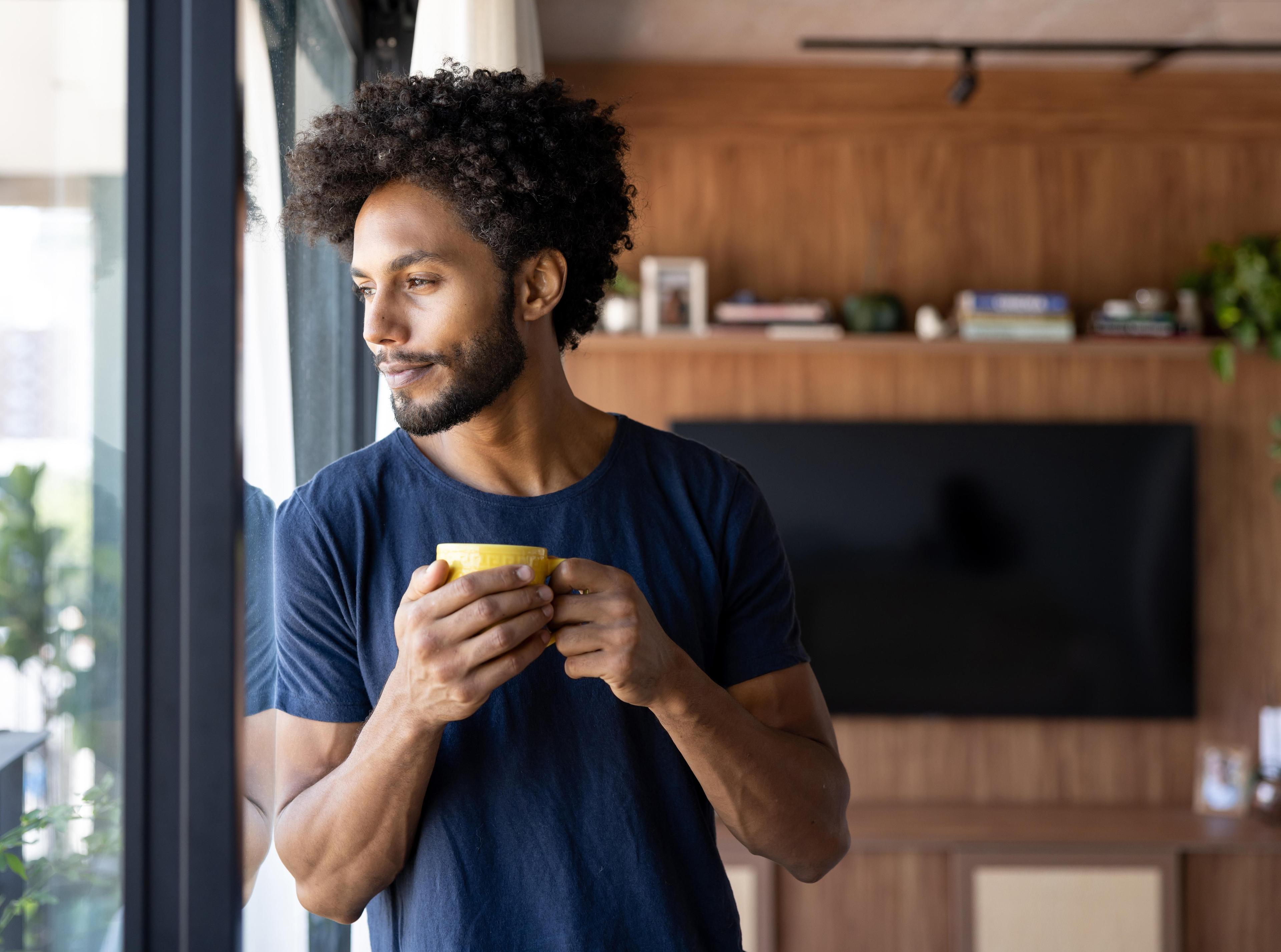 Man drinking a cup of coffee 1475437767.jpg