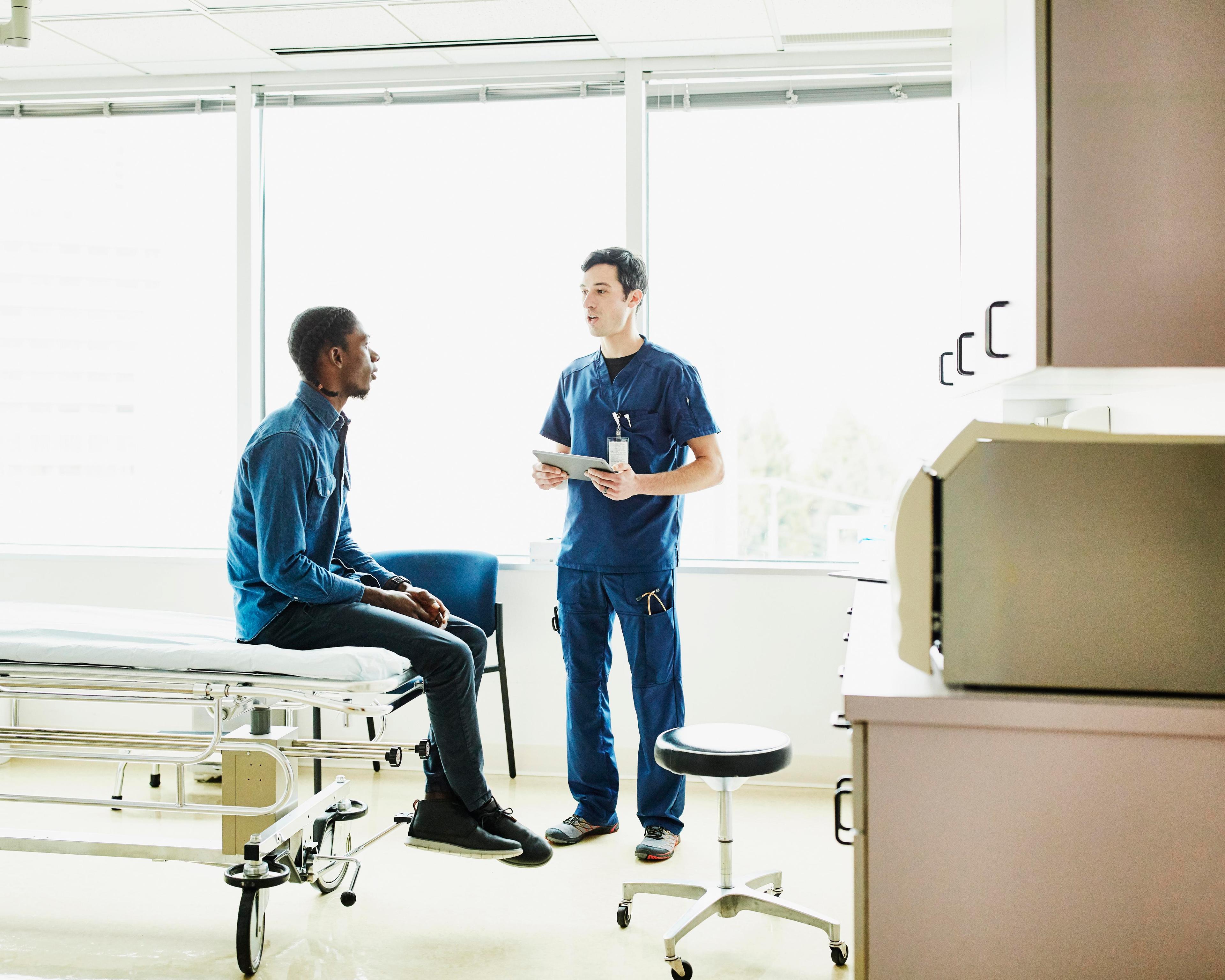 Man speaking to nurse