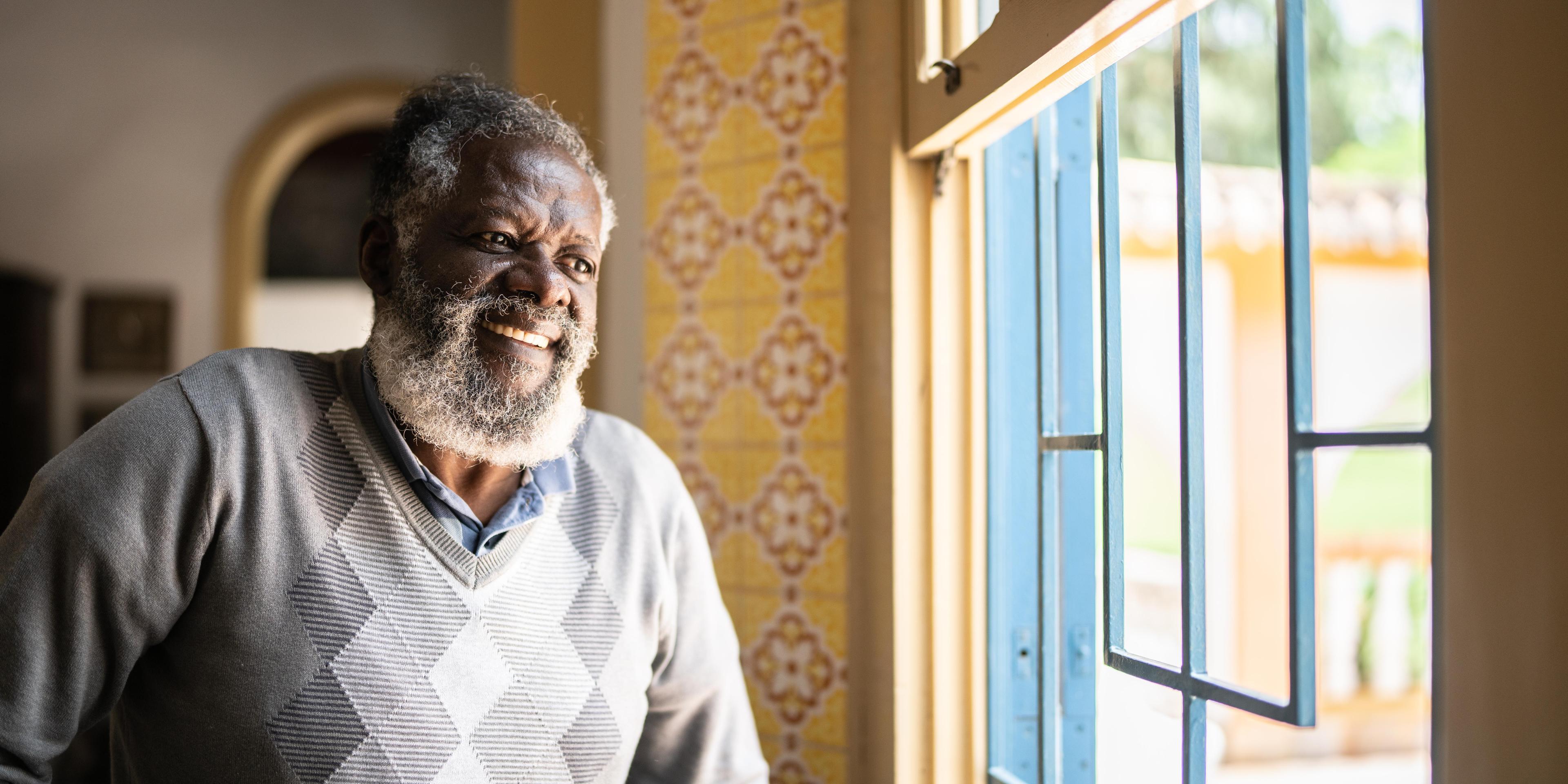 Man looking through a window 1368004989.jpg