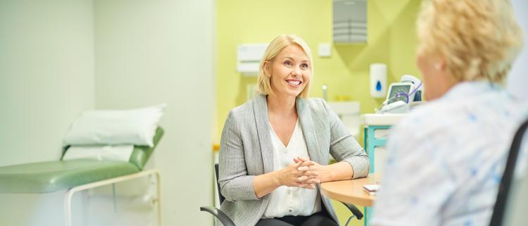 Female gp listening to patient